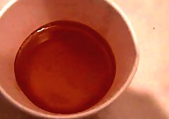 Asian ho pees into cup
