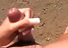 Woman is jerking a boy-friend at the beach for free