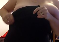 putting on her girdle, soft belly & big boobs.